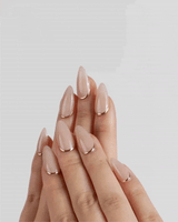 Bare Skin handmade press-on nails featuring Minimalist Nude Chic, Champagne Gold Cuticle Outlines.