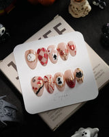 Alice in Wonderland handmade press-on nails in extra short almond shape by Joyee Nails