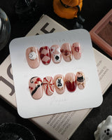 Alice in Wonderland handmade press-on nails in short oval shape by Joyee Nails