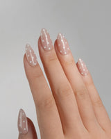 Cloud Cream nail art close-up showing Peach Nude, Sweet White Polka Dots. details