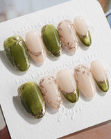 Aquagrass - Liquid Ballerina press-on nails in medium oval shape — Vintage Olive Green, Embossed Gold Leaves & French Tips.