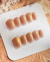 Aurora Flame press-on nails in extra short coffin shape — orange & gold cat eye