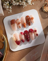 Autumn Bounty press-on nails with hand-painted pumpkin, apple and autumn gold accents