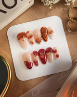 Autumn Bounty press-on nails with glossy harvest fruit nail art and gold detail lines