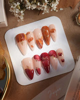 Autumn Bounty press-on nails with dimensional pumpkin, apple and soft nude gel styling