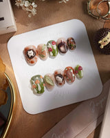 Autumn Tales press-on nails with hand-painted woodland details, mushrooms and hedgehog accents