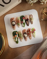 Autumn Tales press-on nails with forest mushroom accents, fall colors and glossy 3D details
