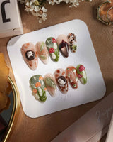 Autumn Tales press-on nails with autumn leaves, mushrooms and playful hedgehog nail art