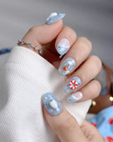 Baby Seals ocean summer press-on nails with sleepy seals and blue wave details