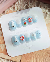 Baby Seals ocean-themed nails with 3D lifebuoys and seal pup accents