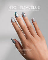 Banff Blue press-on nails in extra short almond shape — Cat Eye Blue Nails with Chrome Outline