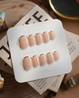 Bare Skin press-on nails in extra short squoval shape — Minimalist Nude Chic, Champagne Gold Cuticle Outlines.