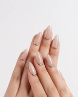 Bare Skin press-on nails in short almond shape — Minimalist Nude Chic, Champagne Gold Cuticle Outlines.
