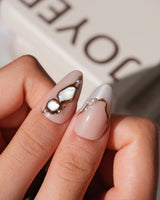 Baroque Pearl L press-on nails in medium almond with glossy nude and pearl details