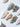 Mauritius Escape beach nails with iridescent white shimmer, shell accents, and pearl drops