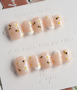 Beebee Nail Art press-on nails in extra short squoval shape — Warm French, Daisy & Honeybee.