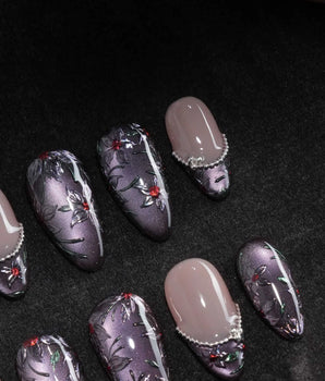 Belladonna press on nails with hand-painted dark lilies in silver outline on violet grey cat eye and nude nails edged in silver beads - image 1