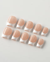 Belle Époque press-on nails in extra short coffin shape — classic French tip nails