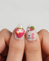 Berry Kitty extra short almond nails with red fruit accents, green leaves, and playful 3D details