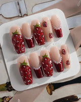 Berry me cute date nails with 3D strawberries, red tips, and faux pearls