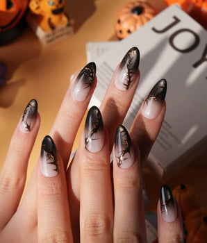 Black Briar press on nails with a nude to black cat eye ombre and raised gold thorn branches - image 1