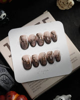 Black Briar handmade press-on nails in short oval shape by Joyee Nails