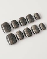 Black Cat-eye press-on nails in extra short squoval shape — black cat eye