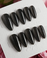 Black Cat-eye press-on nails in medium almond shape — black cat eye