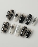 Black & Silver Void press-on nails in medium coffin shape — black aura swirl abstract nails