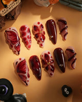 Bloody Kiss handmade press-on nails featuring deep red marble nude base 3D flower chrome beads sculpted gel drip design