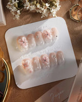 Blush Melt soft pink 3D flower nails with sparkling water-drop details