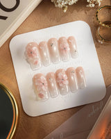 Blush Melt handmade press-on nails with icy petals, shimmer and glossy drops