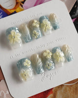 Bora Bora Blue South Pacific nails with ocean shimmer and blooming 3D plumeria