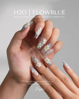 Bora Bora Blue close-up of blue cat-eye water shimmer and white pastel yellow flowers