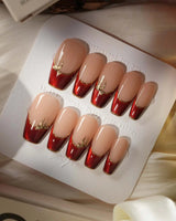 Bow French press-on nails — nude base red chrome french gold outline bow accent handmade nail art by Joyee Nails