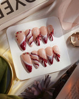 Broadway Rouge nails in medium stiletto — Festive Red & White