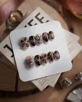 Butterfly Effect nails in extra short oval — Neutral Nude & Black,