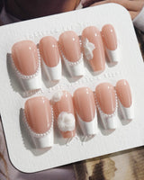 Camellia-Classy AF press-on nails in medium coffin shape — Nude Pink, White French Tips & 3D Camellias