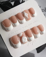 Camellia-Classy AF press-on nails in short oval shape — Nude Pink, White French Tips & 3D Camellias