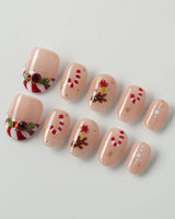 Candy Holiday press-on nails in extra short oval shape — Festive Christmas, Candy Canes & Gingerbread Man.