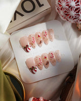 Candy Holiday handmade press-on nails featuring Festive Christmas, Candy Canes & Gingerbread Man.