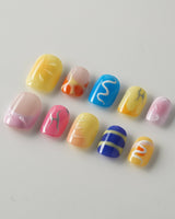 Candy Pop Colored press-on nails in extra short squoval shape — gradient multicolor abstract gloss nails