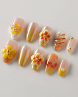 Caramel Bloom press-on nails in extra short almond with glossy caramel floral design