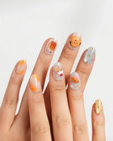 Caramel Toast handmade dessert nails with golden caramel drip and confetti dots