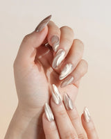 Champagne Ribbons nail art close-up showing Champagne Nude Gold, Silky Cat-eye Textures & Streamlined Wave Luster. details
