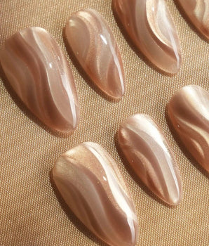 Champagne Ribbons handmade press-on nails featuring Champagne Nude Gold, Silky Cat-eye Textures & Streamlined Wave Luster.