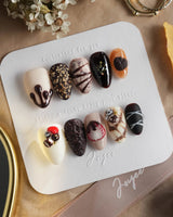 Chocolate Box press-on nails with glossy brown gel and dimensional dessert details