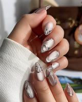 Chrome lines nail art close-up showing Cool-toned Silver Grey Cat Eye, Liquid Metal Lines & 3D Heart. details