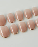 Clean Grace press-on nails in extra short oval shape — gold french tip nails