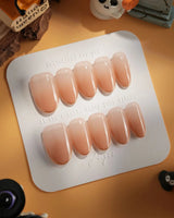 Clean Grace press-on nails in medium oval shape — gold french tip nails